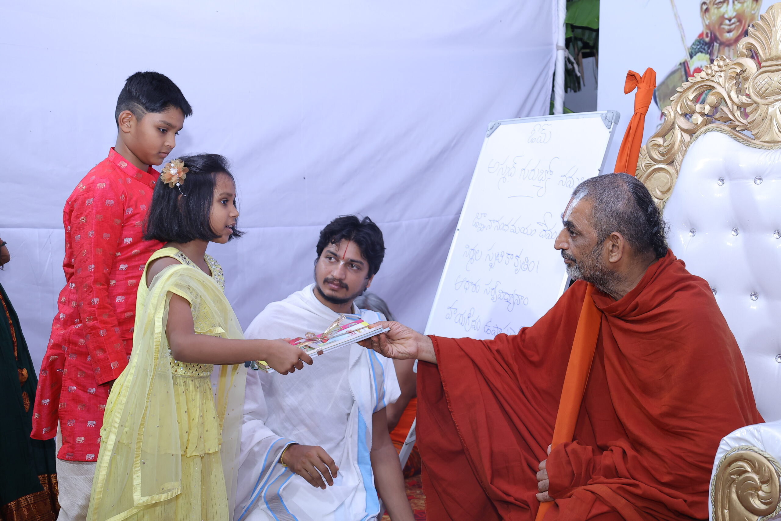 kids Taking Books from Chinna jeeyar Swamiji